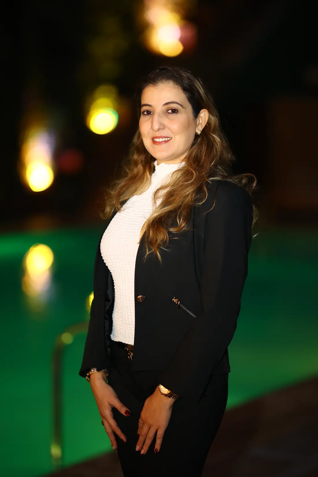 Guest portrait by the pool at night