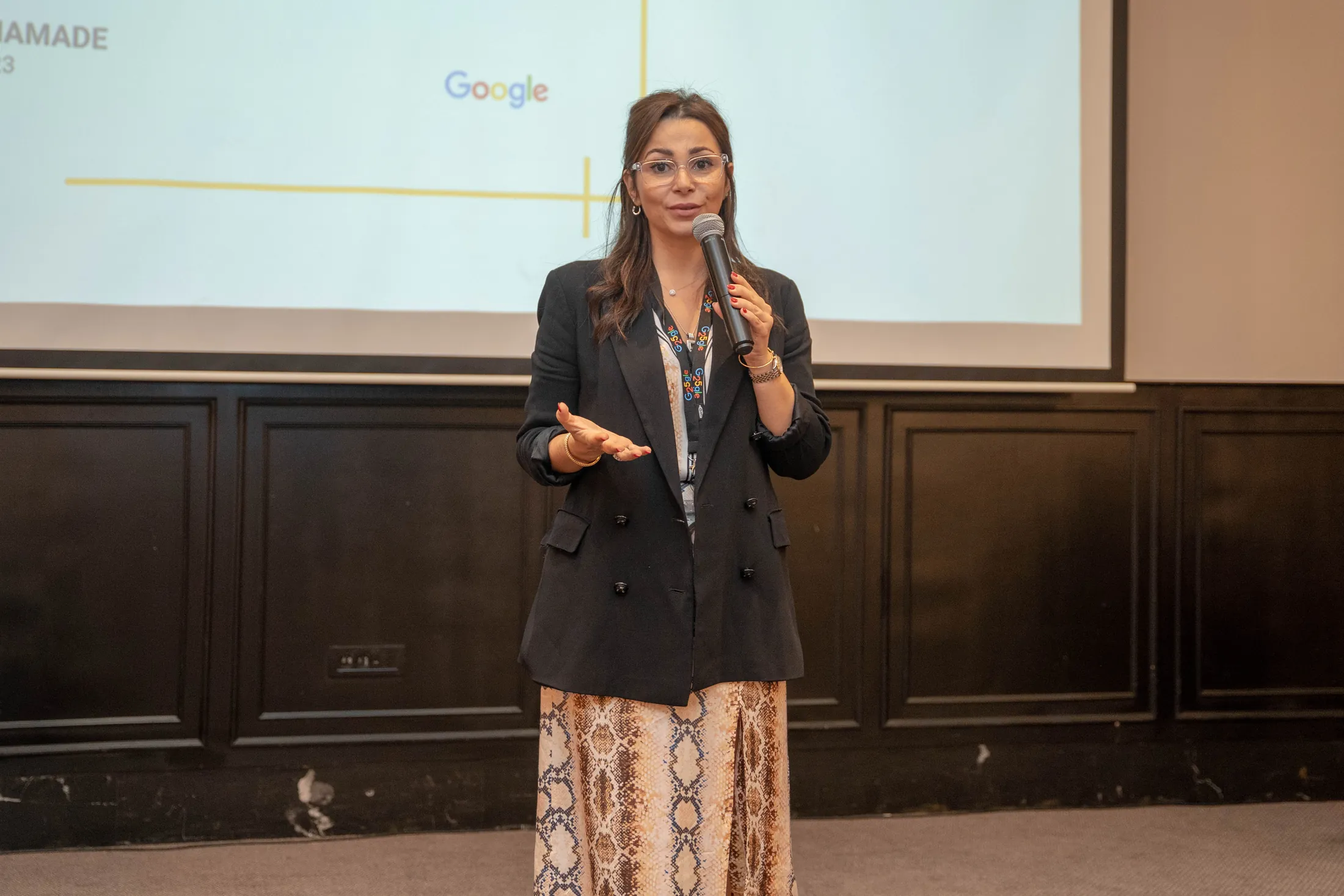 Speaker in front of the Google Cloud slide