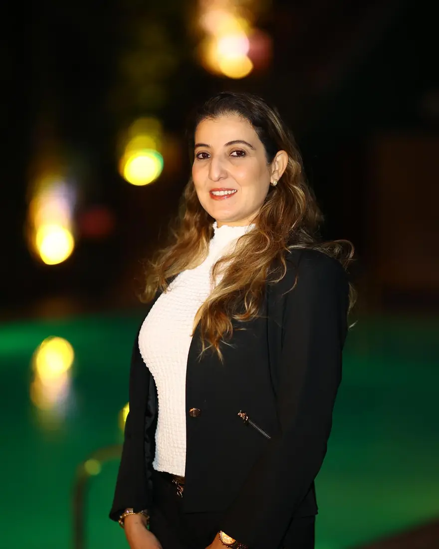 Guest portrait by the pool at night